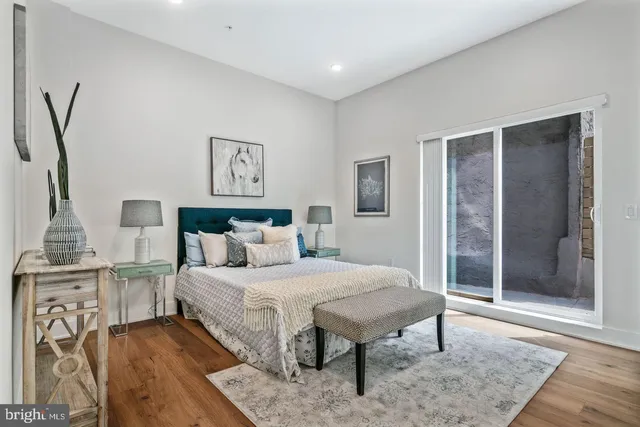 a bedroom with a bed and a table