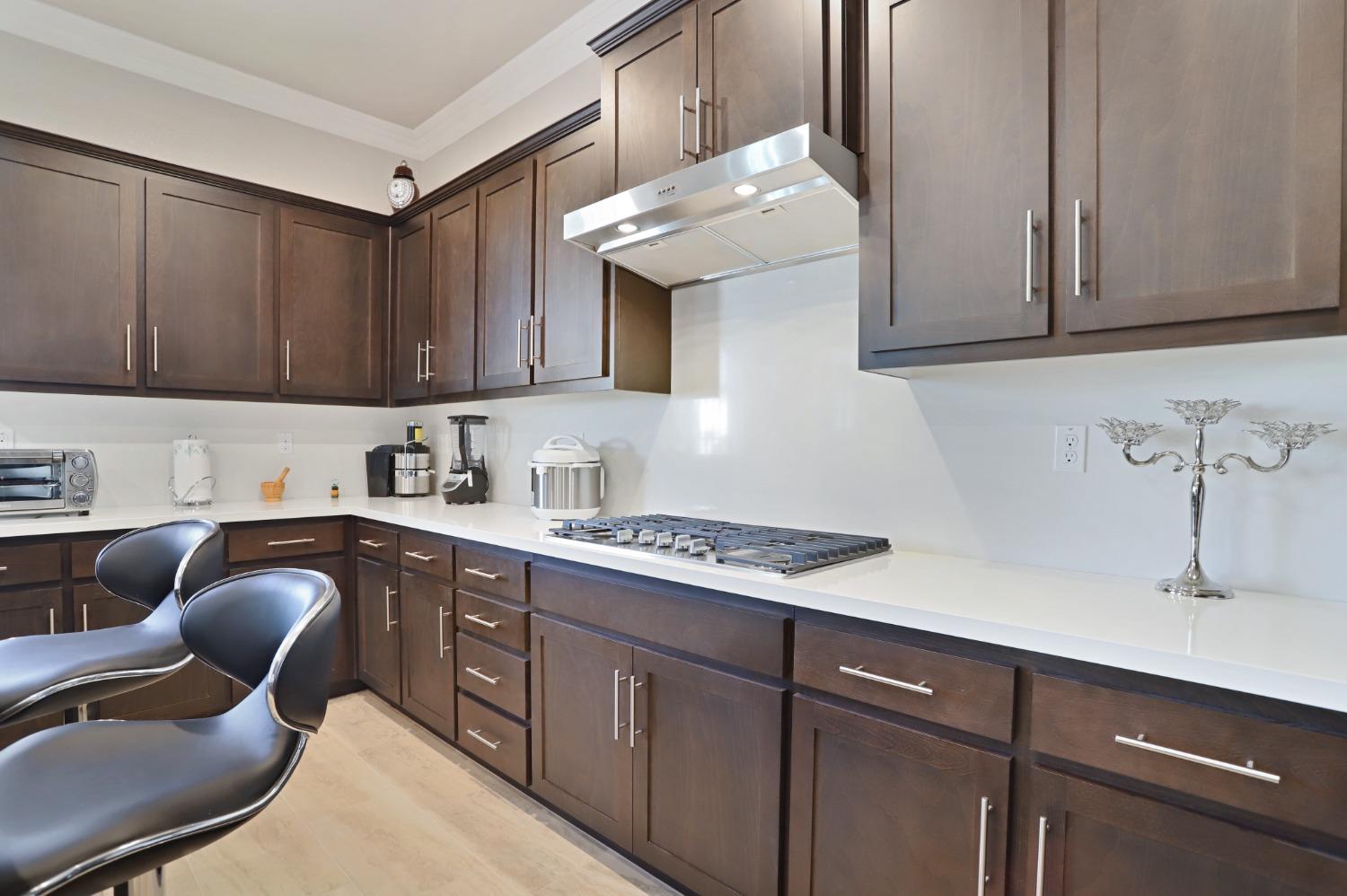2925 Fuchsia Drive Lodi, CA 95242 - Photo 11 of 44 a kitchen with stainless steel appliances granite countertop a sink stove and cabinets