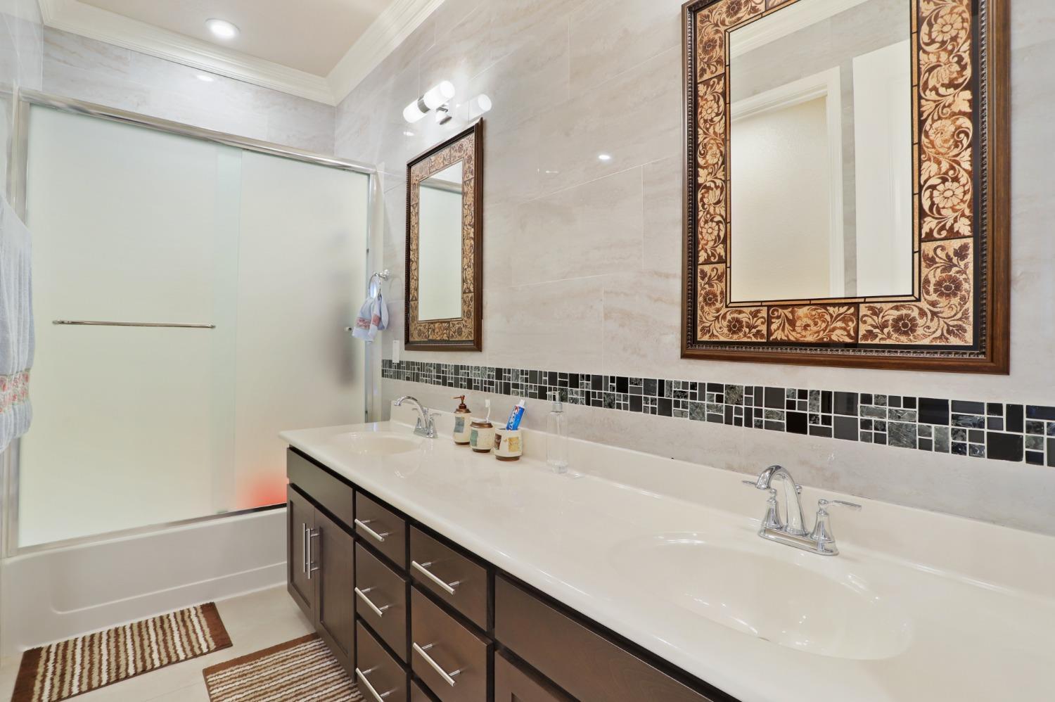 2925 Fuchsia Drive Lodi, CA 95242 - Photo 24 of 44 a bathroom with a sink and a mirror