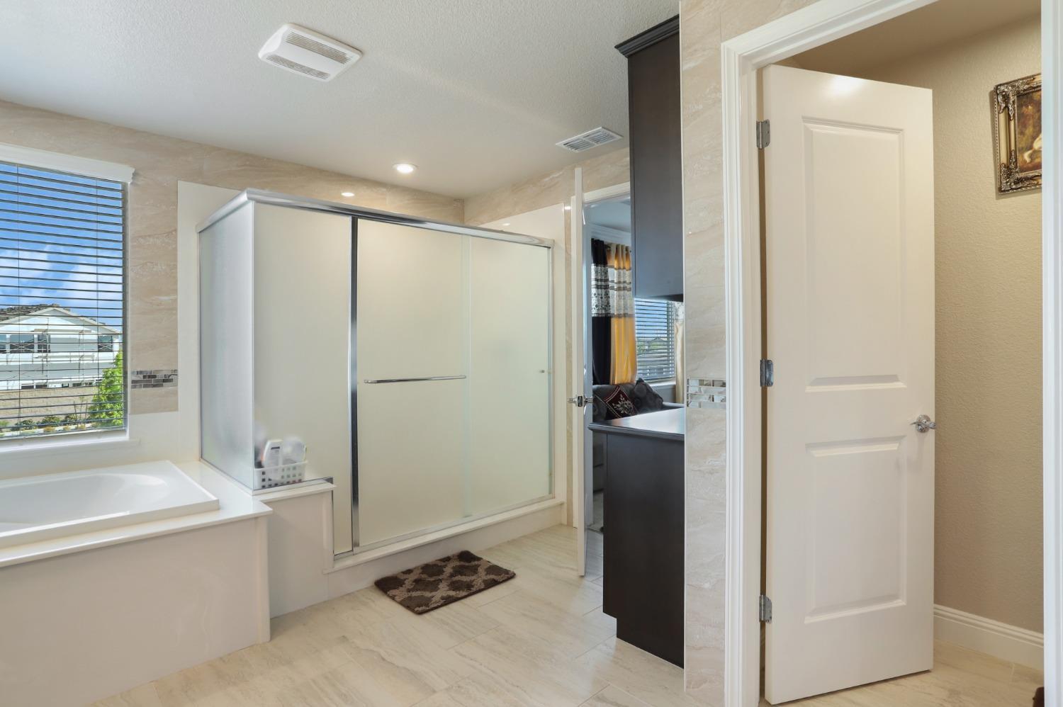 2925 Fuchsia Drive Lodi, CA 95242 - Photo 34 of 44 a bathroom with a tub shower and sink