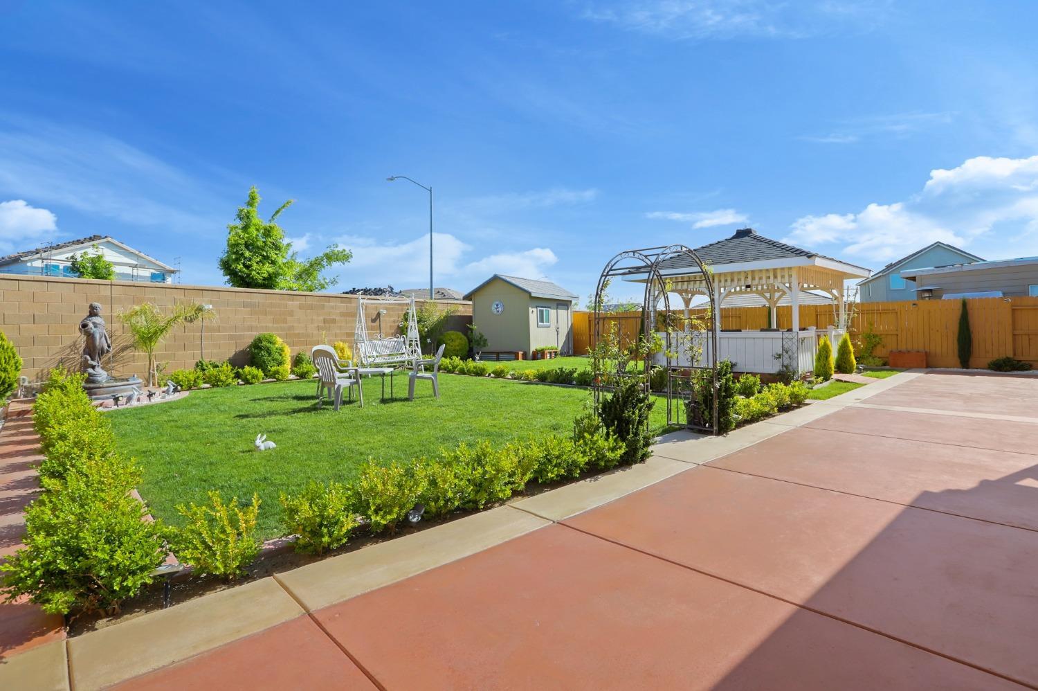 2925 Fuchsia Drive Lodi, CA 95242 - Photo 42 of 44 a front view of a house with a yard