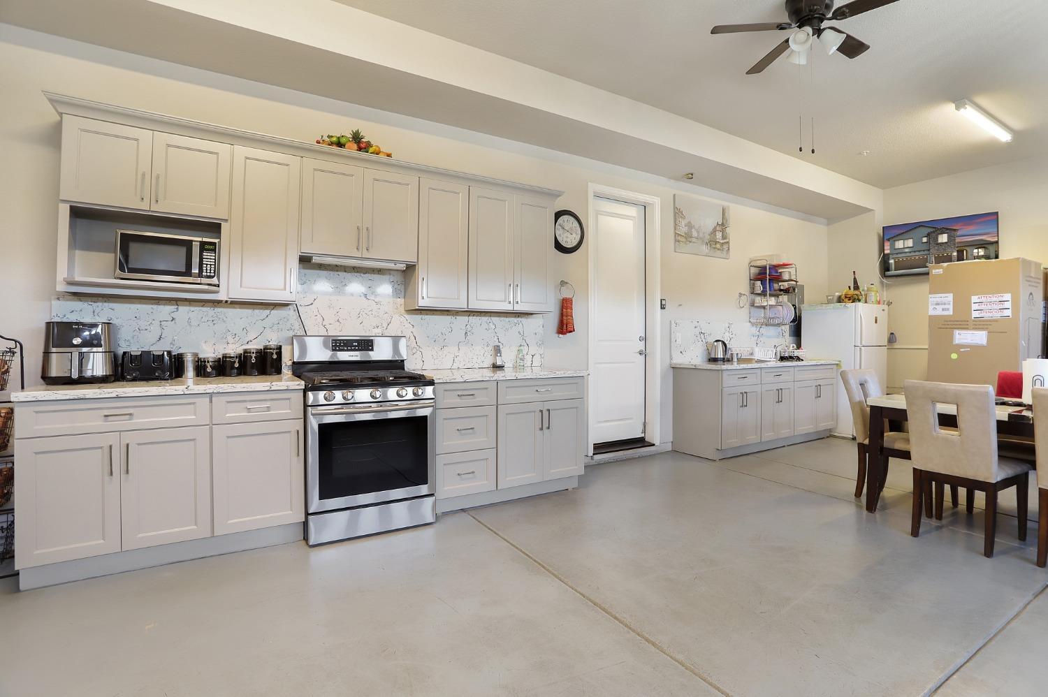 2925 Fuchsia Drive Lodi, CA 95242 - Photo 43 of 44 a kitchen with cabinets and window