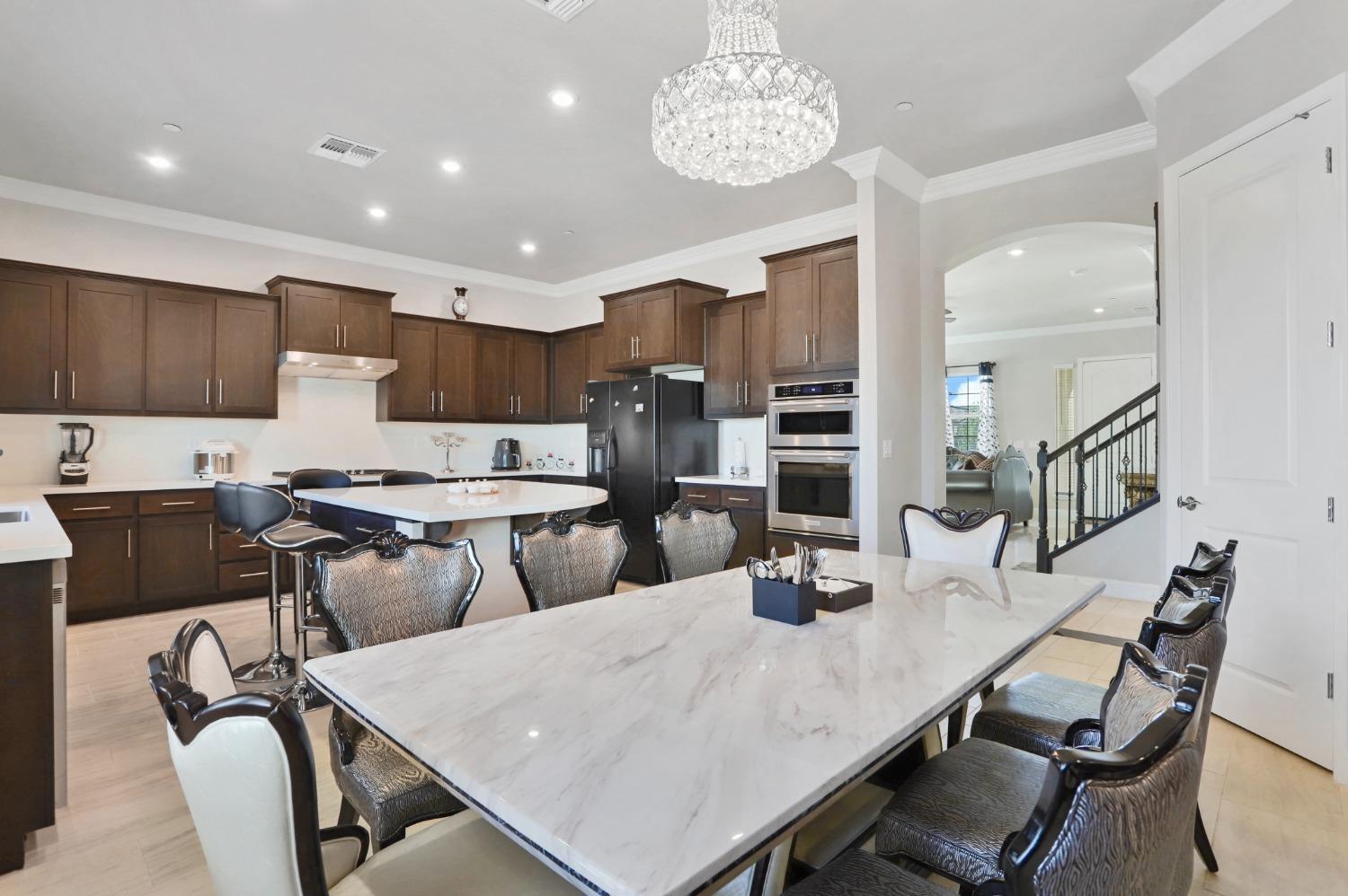 2925 Fuchsia Drive Lodi, CA 95242 - Photo 10 of 44 a large kitchen with a table and chairs