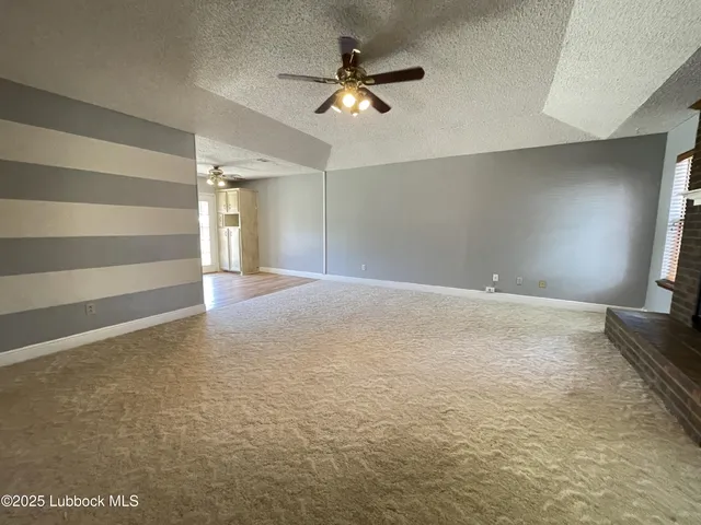 a view of a livingroom with a ceiling fan
