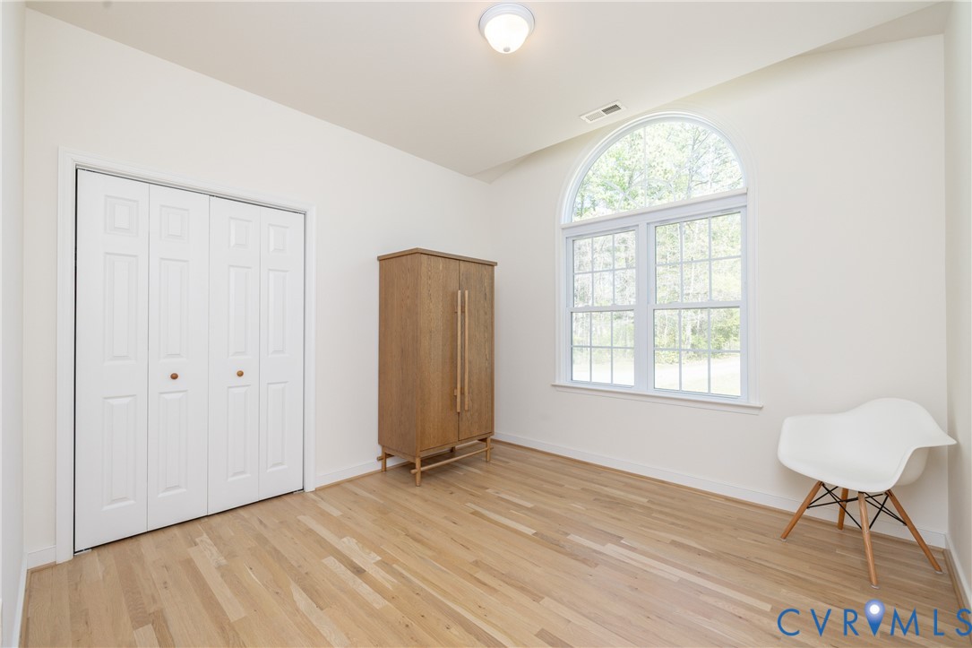 15618 Rowlett Road Chesterfield, VA 23838 - Photo 13 of 29 a view of an empty room with a window and wooden floor