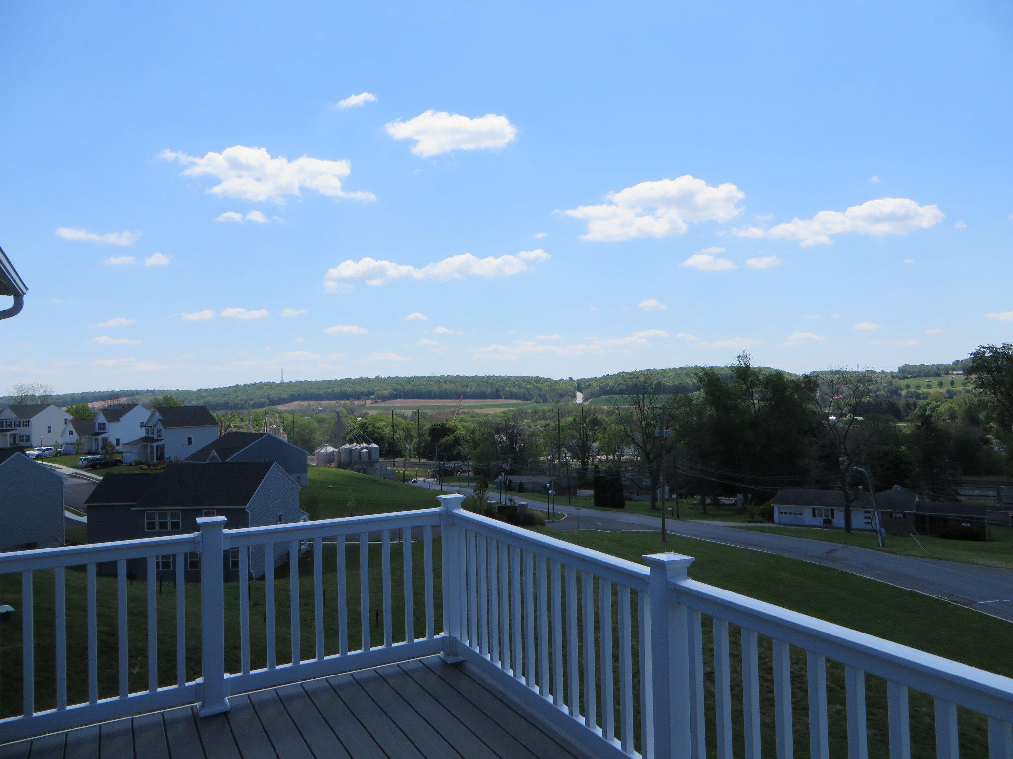 415 Courtland Road Atglen, PA 19310 - Photo 23 of 26 a balcony with wooden floor and city view