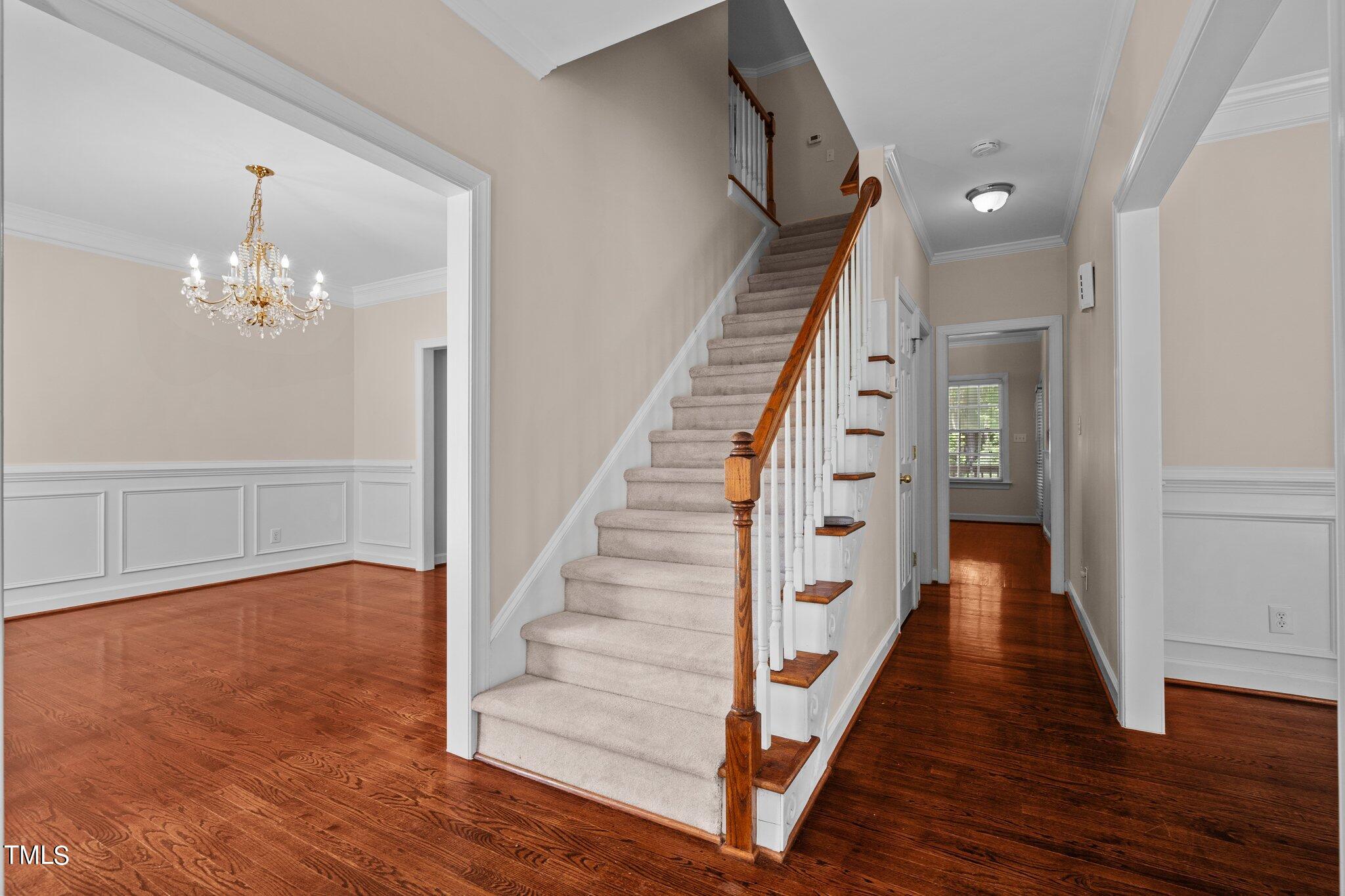 2404 Sunnystone Way Raleigh, NC 27613 - Photo 16 of 51 a view of an entryway with wooden floor