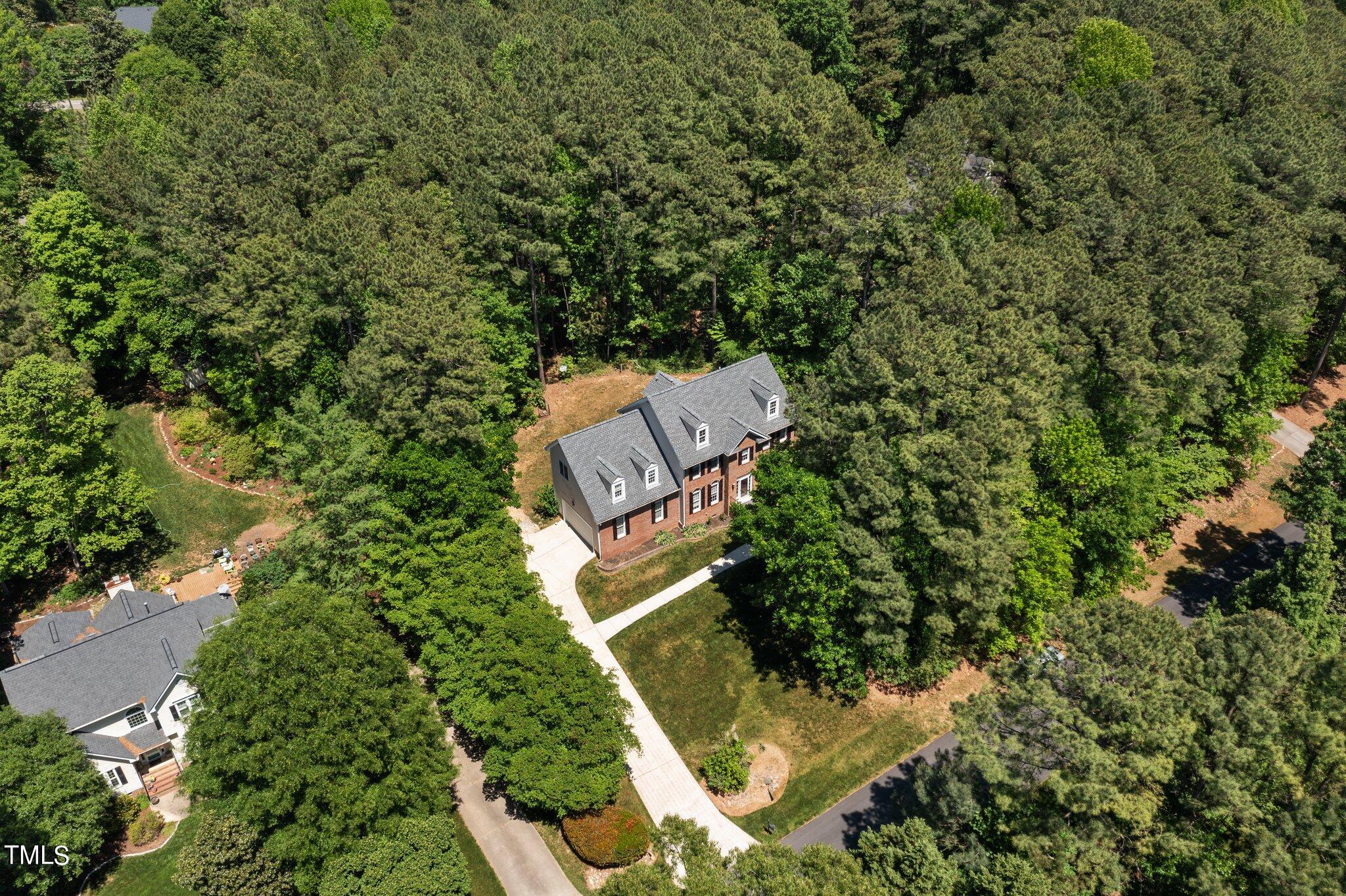 2404 Sunnystone Way Raleigh, NC 27613 - Photo 47 of 51 an aerial view of a house with a yard