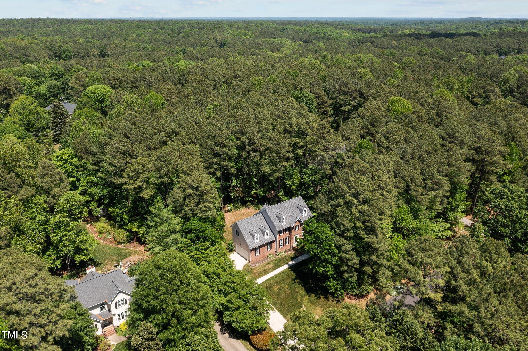 2404 Sunnystone Way Raleigh, NC 27613 - Photo 48 of 51 an aerial view of a house with a yard