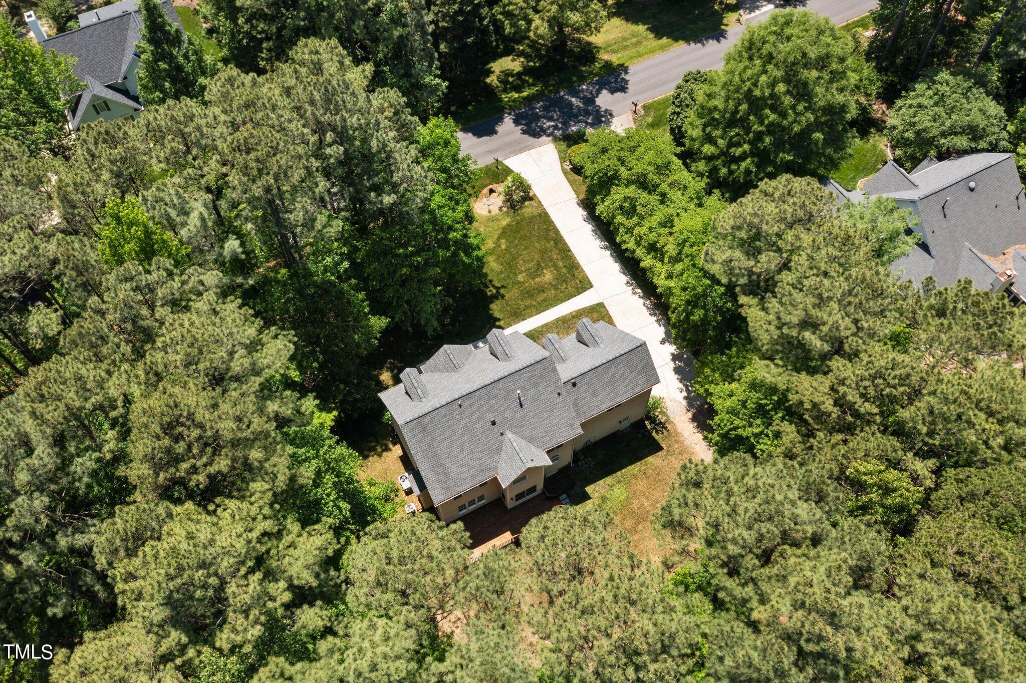 2404 Sunnystone Way Raleigh, NC 27613 - Photo 50 of 51 an aerial view of house with yard and outdoor seating