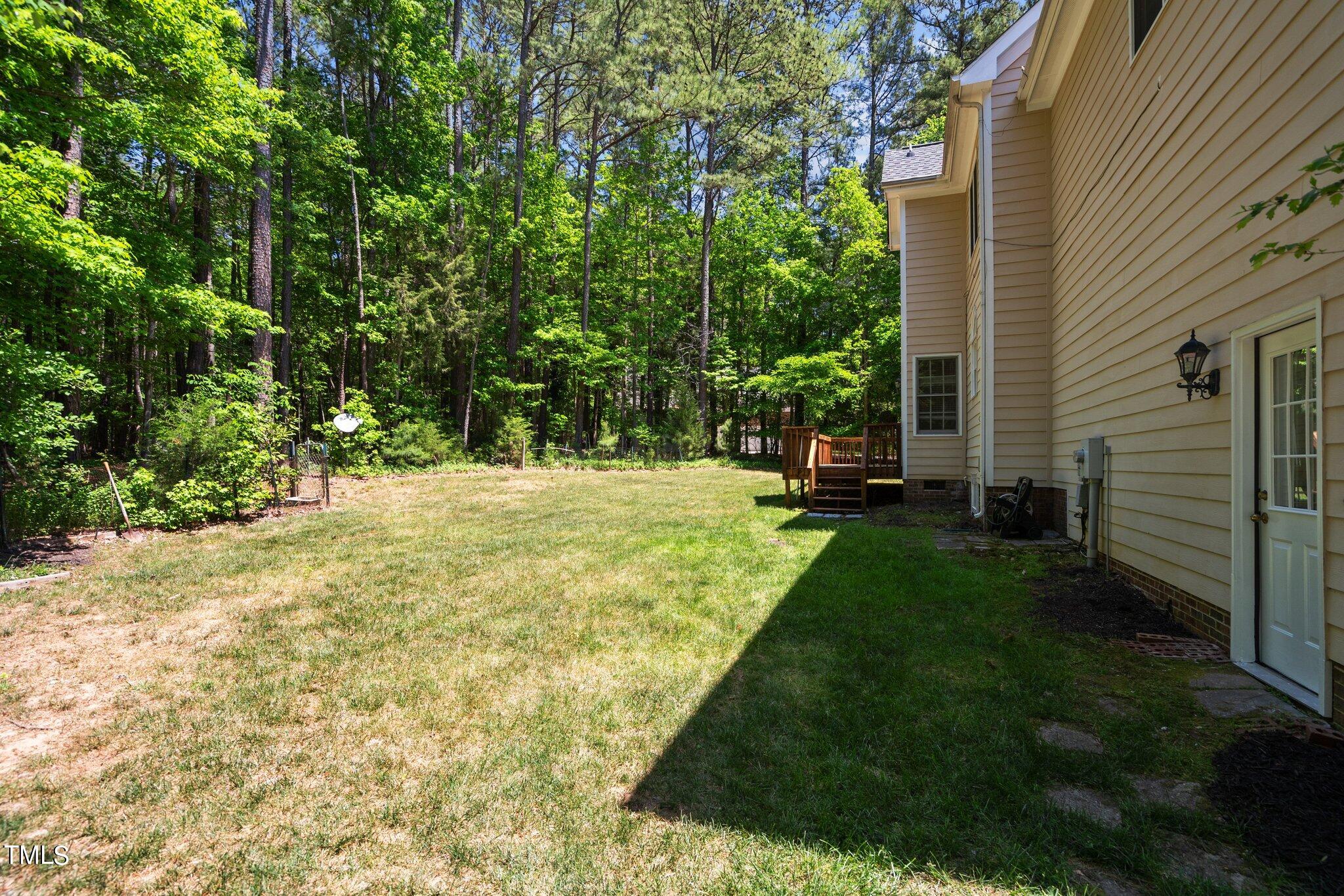 2404 Sunnystone Way Raleigh, NC 27613 - Photo 7 of 51 a view of a backyard with sitting area