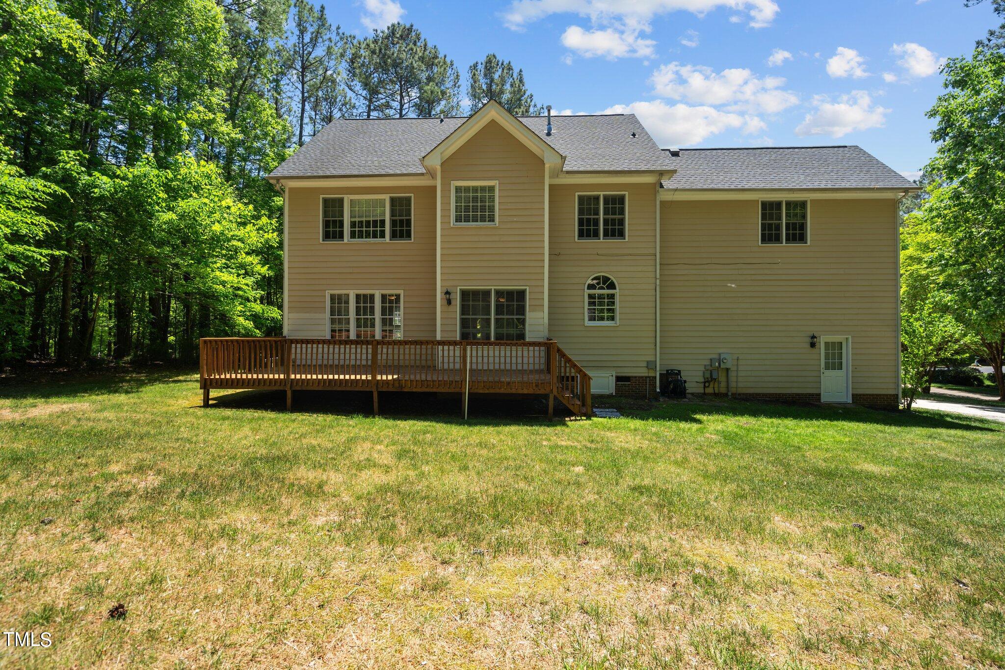 2404 Sunnystone Way Raleigh, NC 27613 - Photo 10 of 51 a front view of a house with a yard