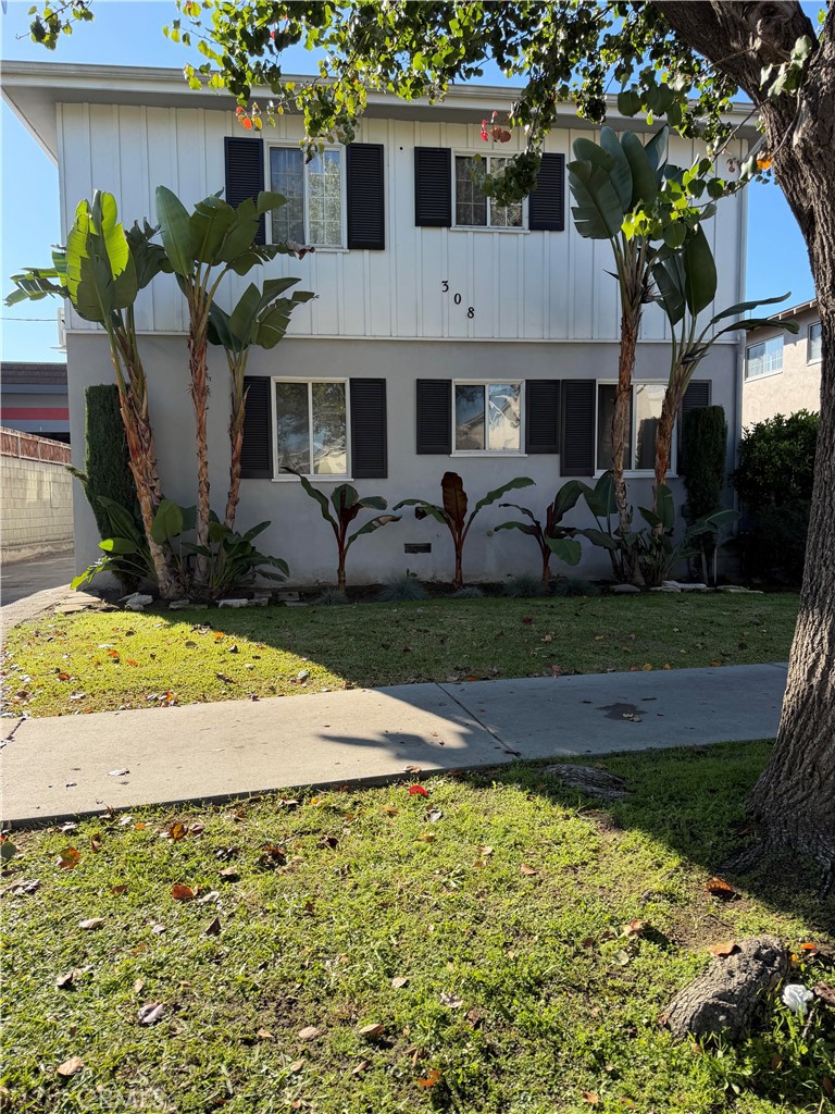 308 East Maple Street, Unit 3 Glendale, CA 91205 - Photo 1 of 1 a front view of a house with garden