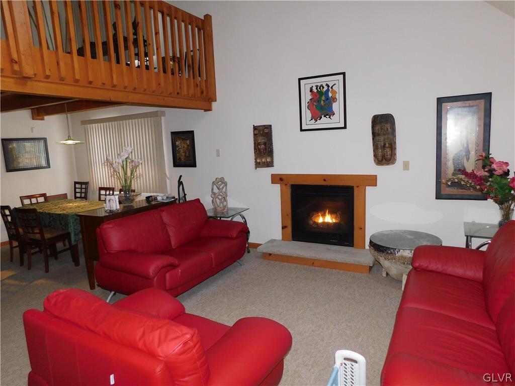 1035 Sundew Road Lake Ariel, PA 18436 - Photo 3 of 5 Family room with fireplace and view of loft