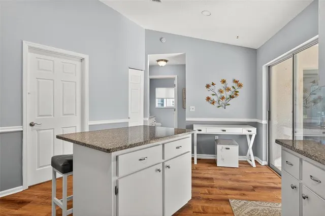 a spacious bedroom with a bed and a large window