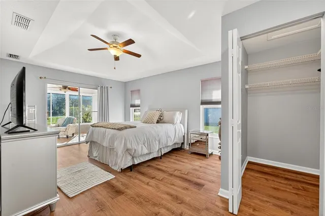 a spacious bathroom with a granite countertop sink and a mirror