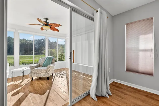 a bathroom with a granite countertop shower a mirror and a sink