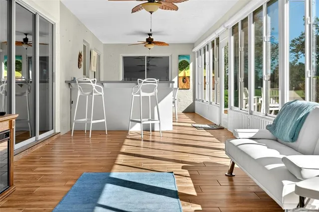 a bathroom with a granite countertop sink vanity mirror and toilet