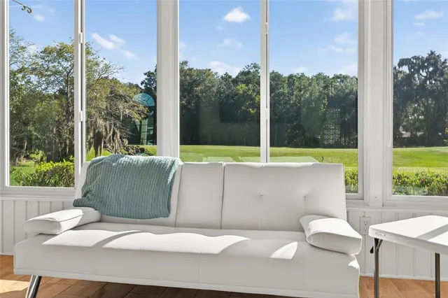 a view of a swimming pool with an outdoor space and seating area