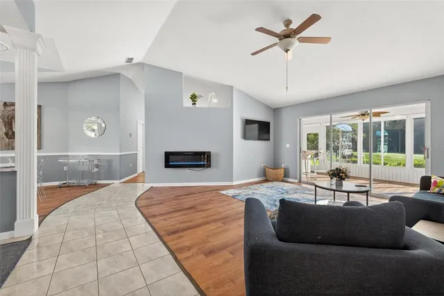 a living room with furniture and a rug