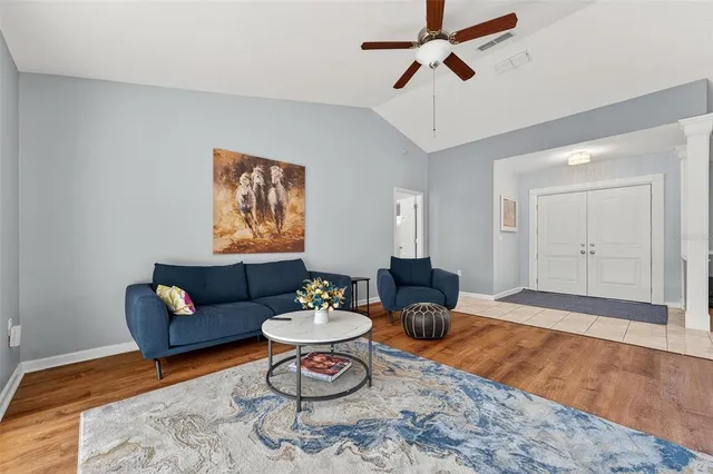 a spacious bathroom with a granite countertop sink and a mirror