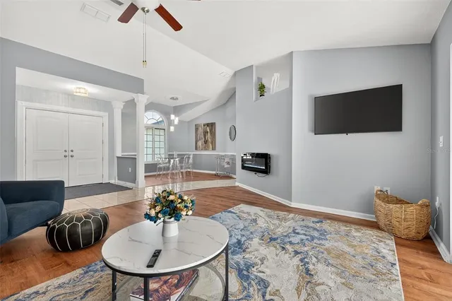 a view of a dining room with furniture and wooden floor