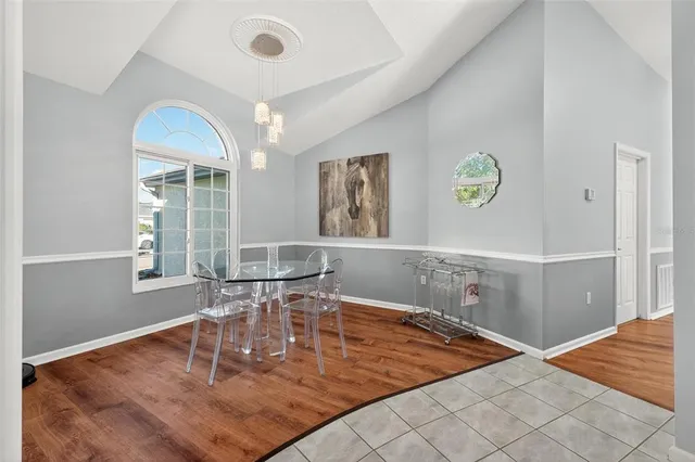 a kitchen with stainless steel appliances granite countertop a stove top oven a sink dishwasher and cabinets with wooden floor