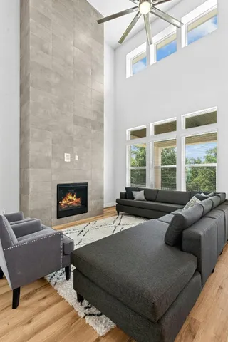 a living room with furniture and a large window