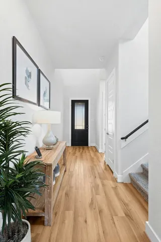 a bedroom with a bed and a painting on the wall