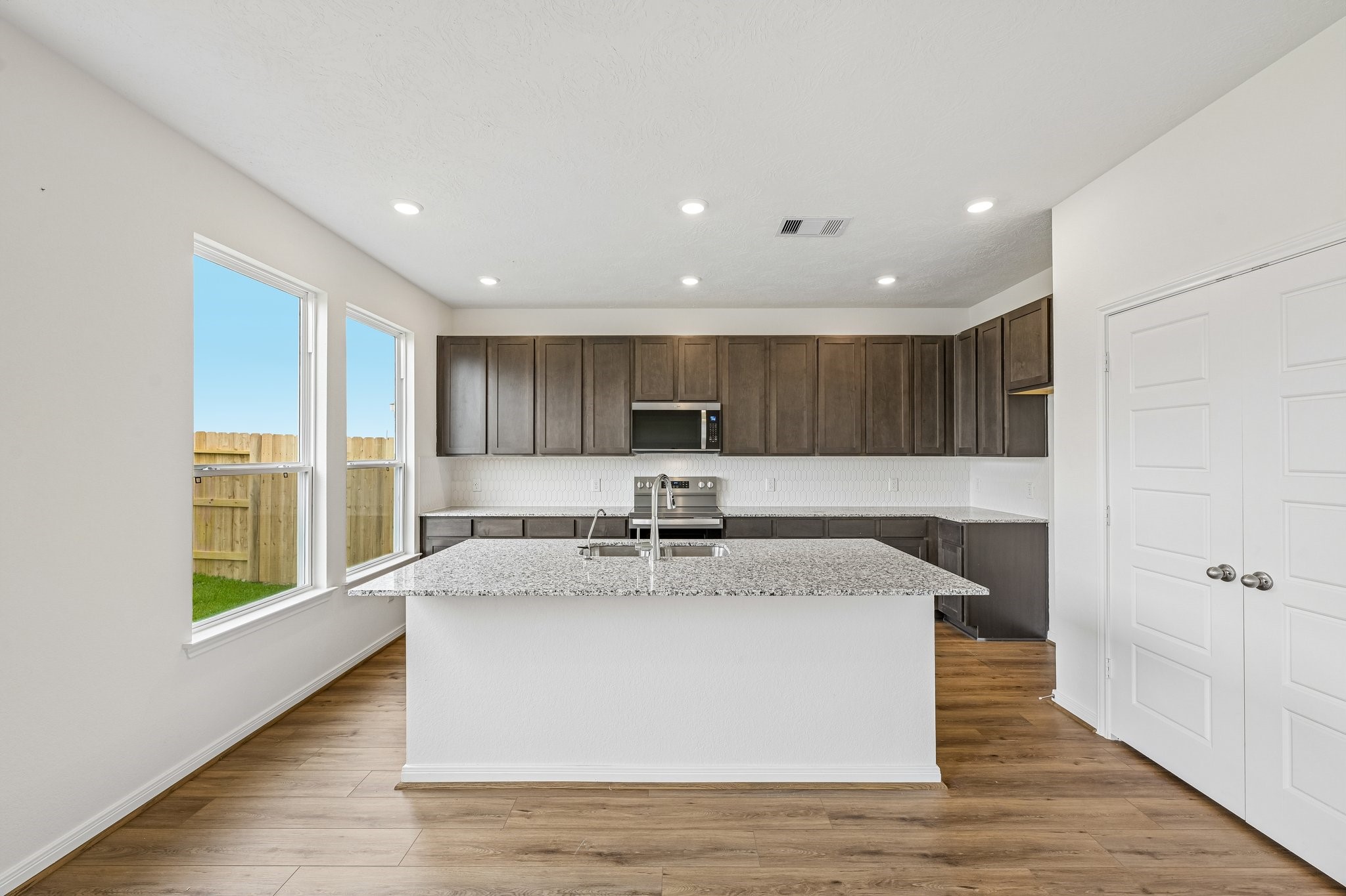 2503 Spruce Hl Road Beasley, TX 77417 - Photo 10 of 25 This spacious kitchen has it all—ample storage, generous counter space, and a layout that truly makes it the heart of the home.