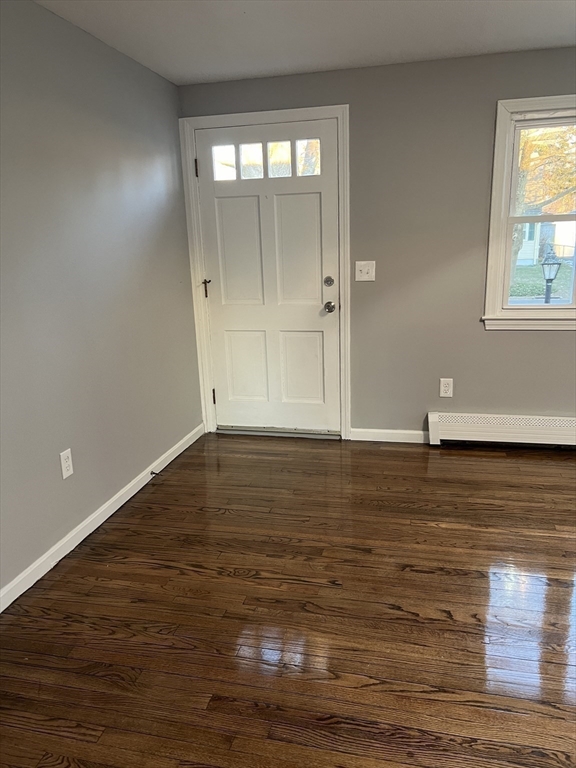 72 Clement Street Springfield, MA 01118 - Photo 18 of 36 a view of empty room with wooden floor and fan