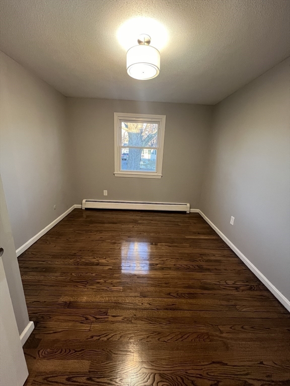72 Clement Street Springfield, MA 01118 - Photo 25 of 36 a view of room with hardwood floor and a ceiling fan