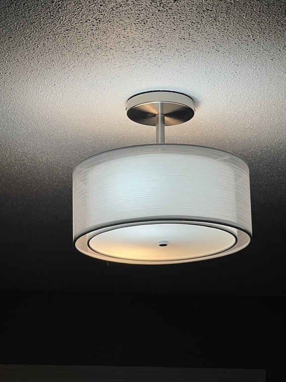 72 Clement Street Springfield, MA 01118 - Photo 26 of 36 a view of a room with a chandelier