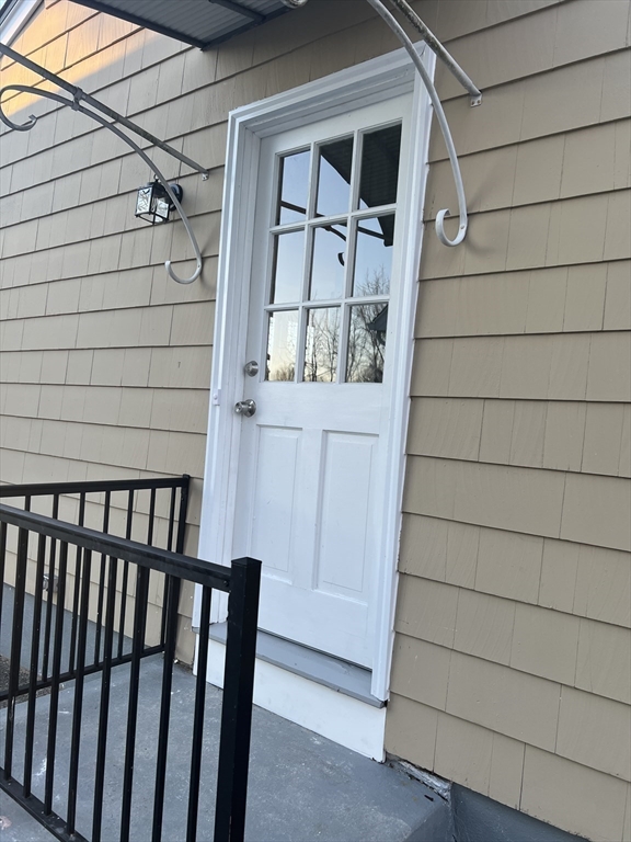 72 Clement Street Springfield, MA 01118 - Photo 3 of 36 a view of front door and wooden door