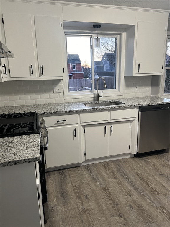 72 Clement Street Springfield, MA 01118 - Photo 10 of 36 a kitchen with granite countertop a sink and cabinets