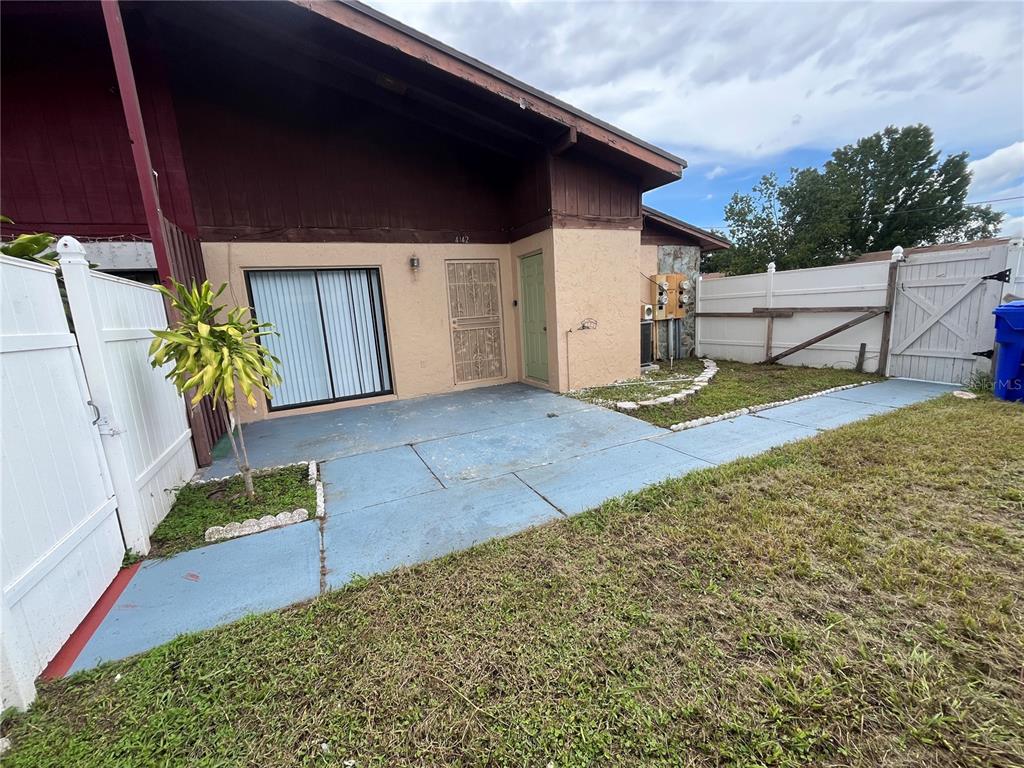 4142 Flying Fortress Avenue Kissimmee, FL 34741 - Photo 2 of 12 a view of back yard of the house