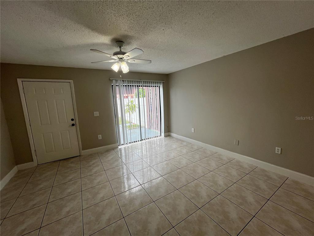4142 Flying Fortress Avenue Kissimmee, FL 34741 - Photo 3 of 12 a view of an empty room with a window