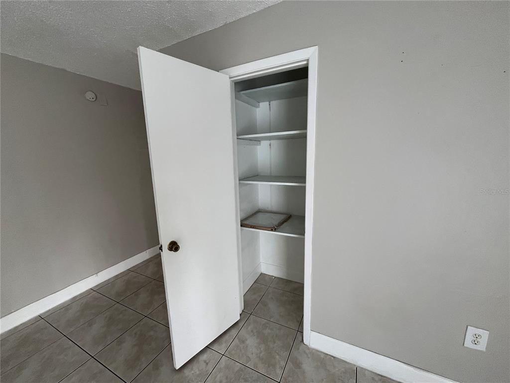 4142 Flying Fortress Avenue Kissimmee, FL 34741 - Photo 9 of 12 a view of an empty walk in closet