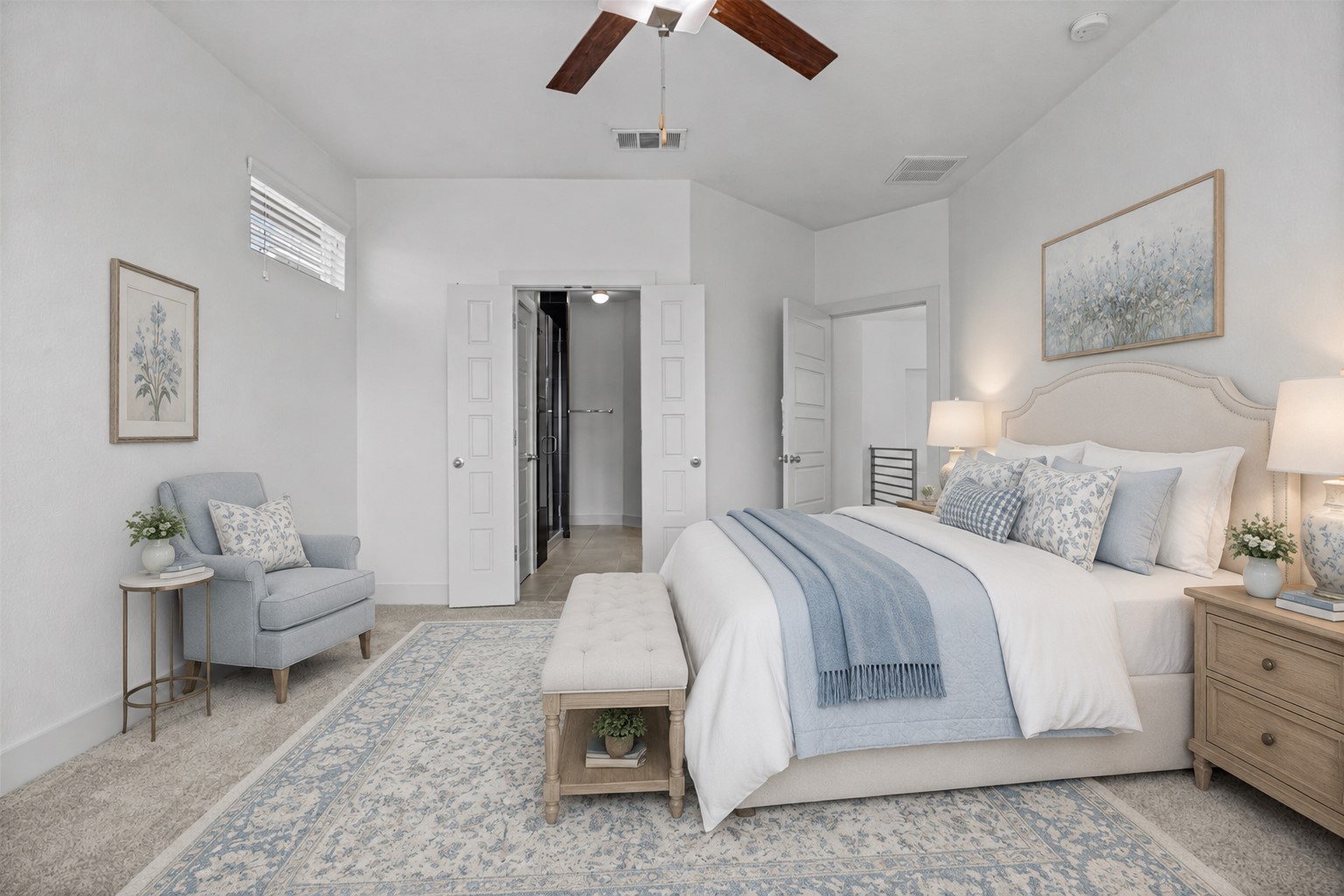 2303 Capulet Street Austin, TX 78741 - Photo 12 of 24 The inviting primary bedroom features fresh NEW carpet and a ceiling fan for added comfort. A private ensuite bathroom creates a convenient and relaxing retreat. This picture is virtually staged.
