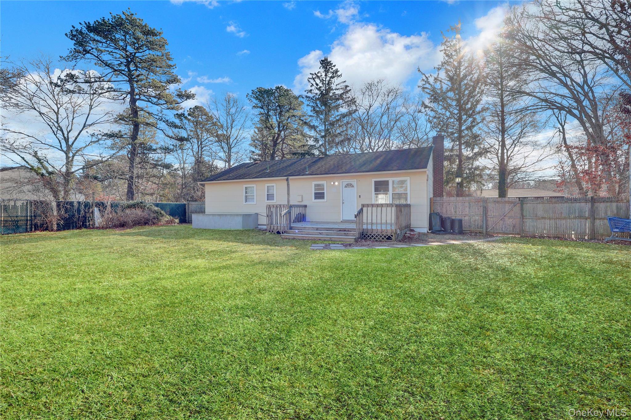 57 Middle Island Road Medford, NY 11763 - Photo 20 of 28 a view of house with a big yard
