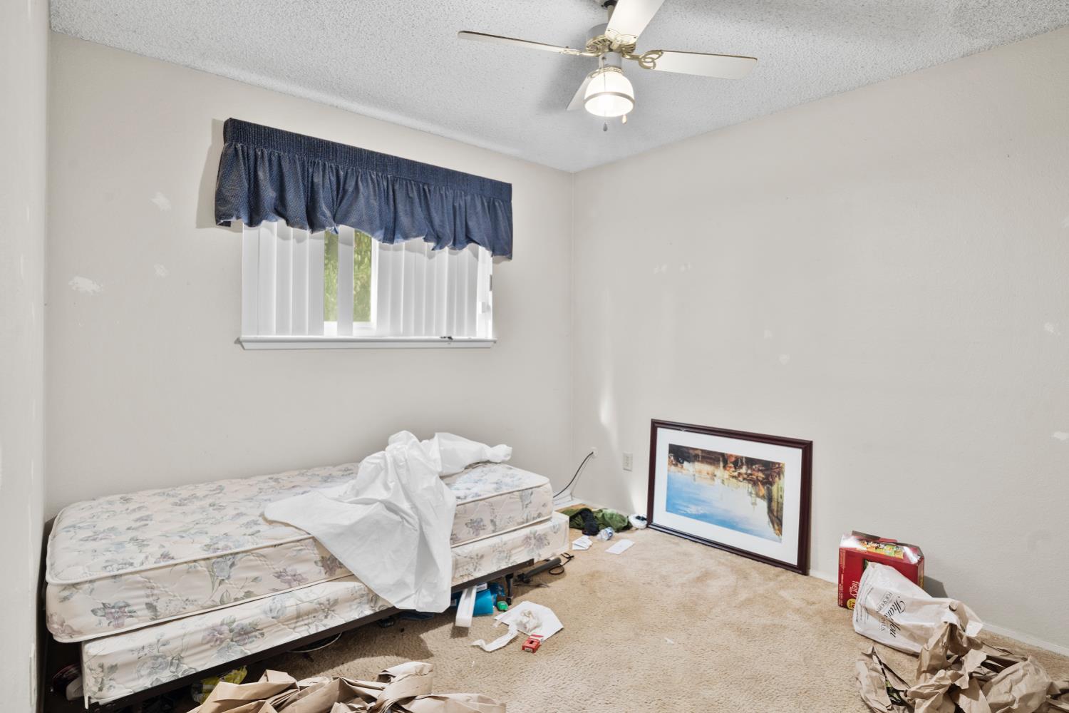 3141 Lisa Drive Modesto, CA 95350 - Photo 18 of 29 a bedroom with a bed and a window