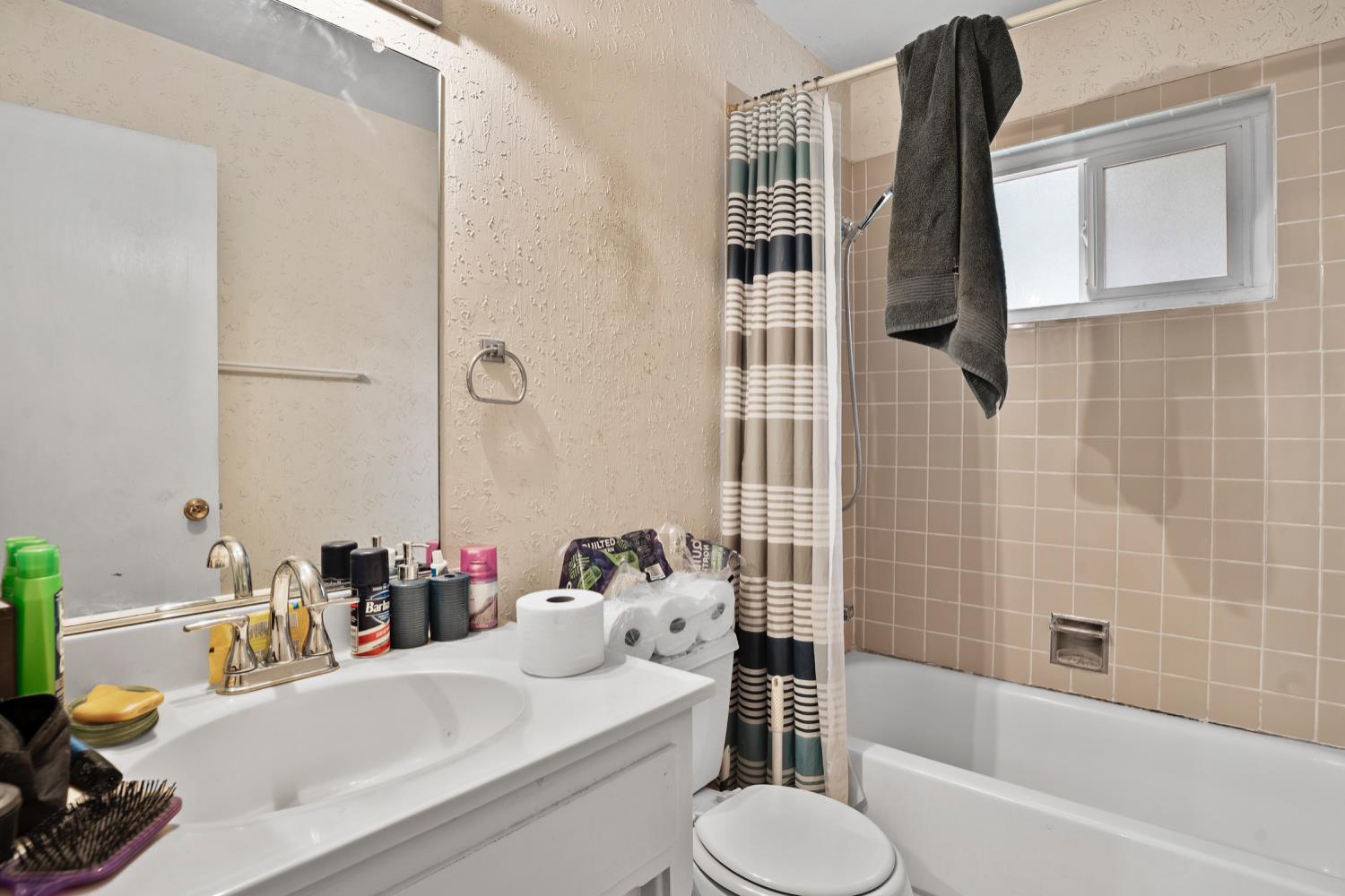 3141 Lisa Drive Modesto, CA 95350 - Photo 19 of 29 a bathroom with a sink toilet and shower