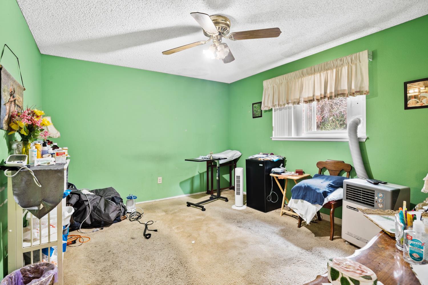 3141 Lisa Drive Modesto, CA 95350 - Photo 21 of 29 a bed room with furniture and a window