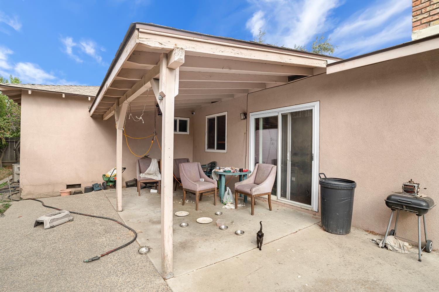 3141 Lisa Drive Modesto, CA 95350 - Photo 24 of 29 a view of a patio with table and chairs a barbeque