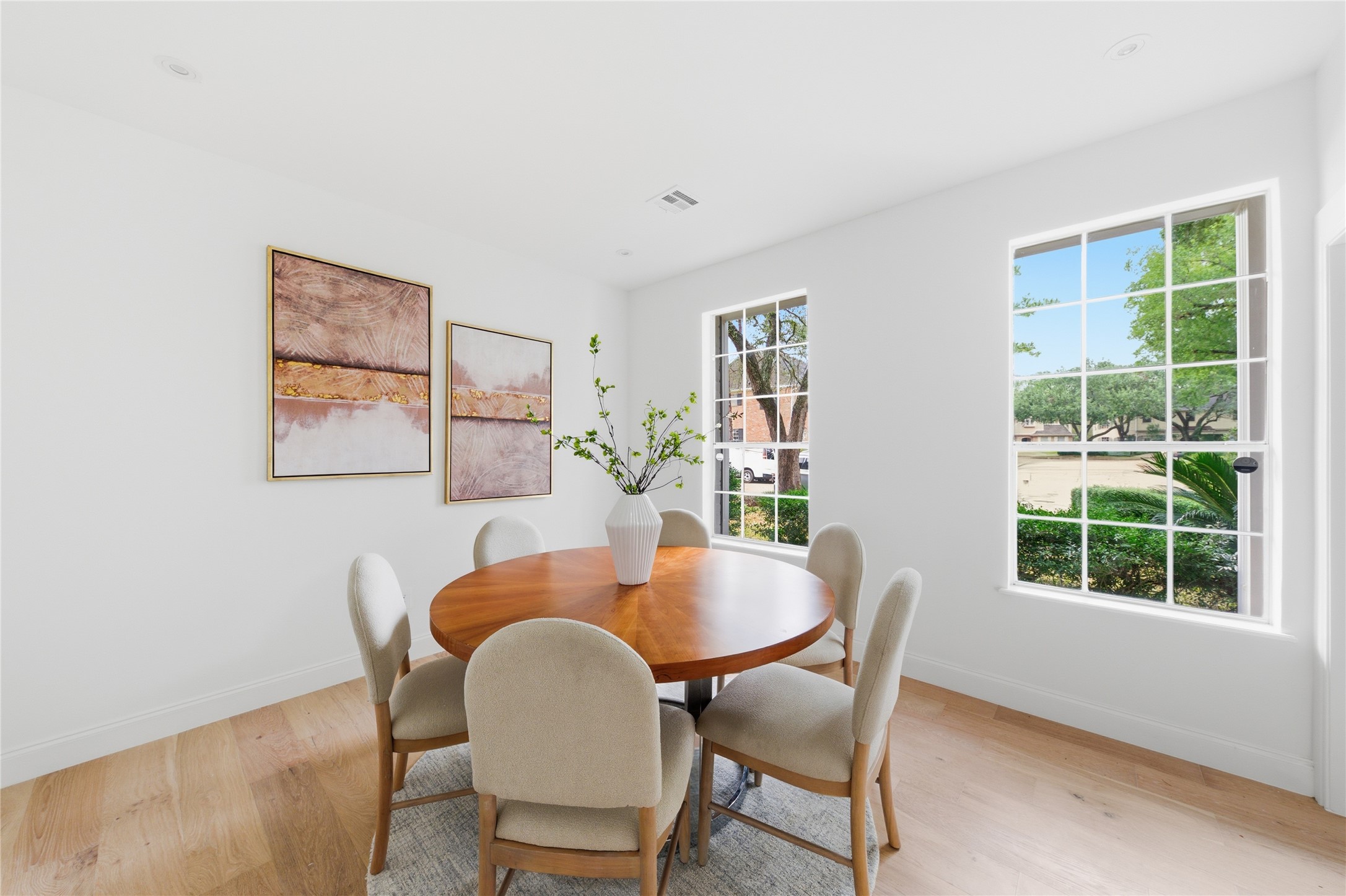 15827 Foxgate Road Houston, TX 77079 - Photo 11 of 37 Charming dining room with oversized windows offering peaceful front yard views and abundant natural light. Creating a welcoming setting for everyday meals or hosting.