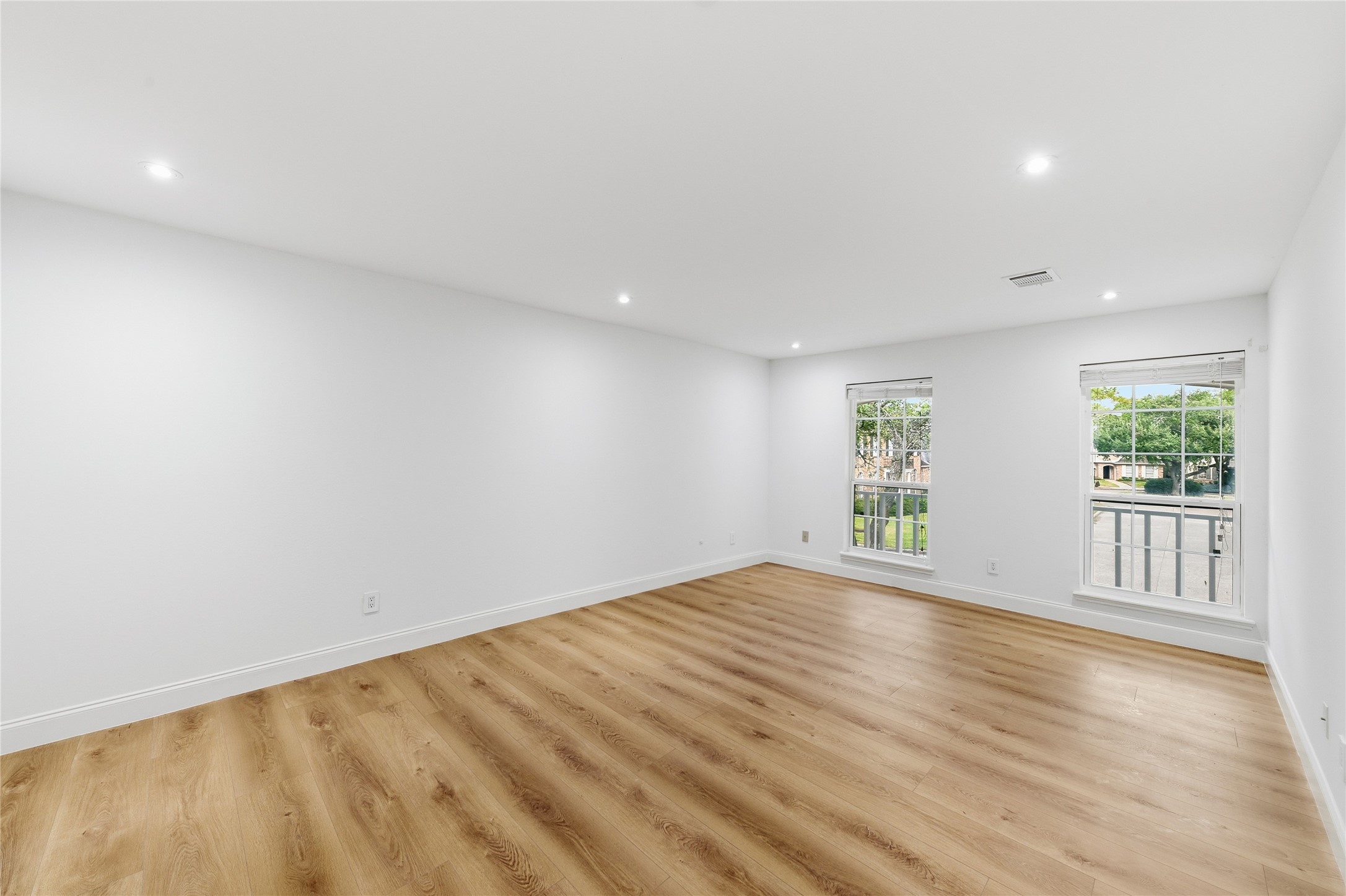 15827 Foxgate Road Houston, TX 77079 - Photo 28 of 37 Spacious upstairs ensuite bedroom with large windows offering natural sunlight and neighborhood views. Convenient access to its own full bathroom makes this an ideal retreat for guests or extended stays.