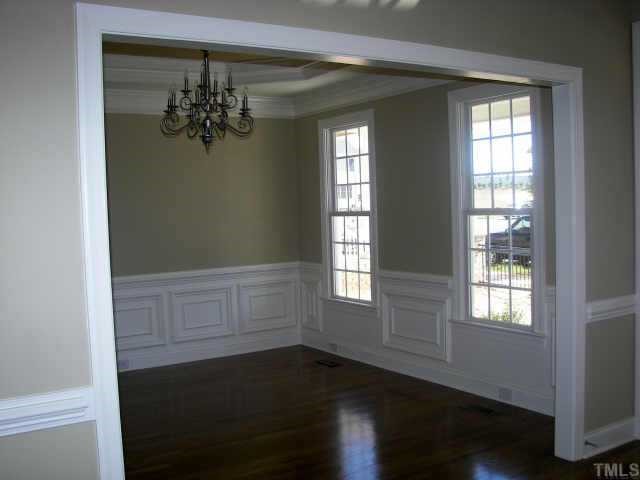 1364 Ileagnes Road Raleigh, NC 27603 - Photo 9 of 10 a view of an empty room with wooden floor and a window