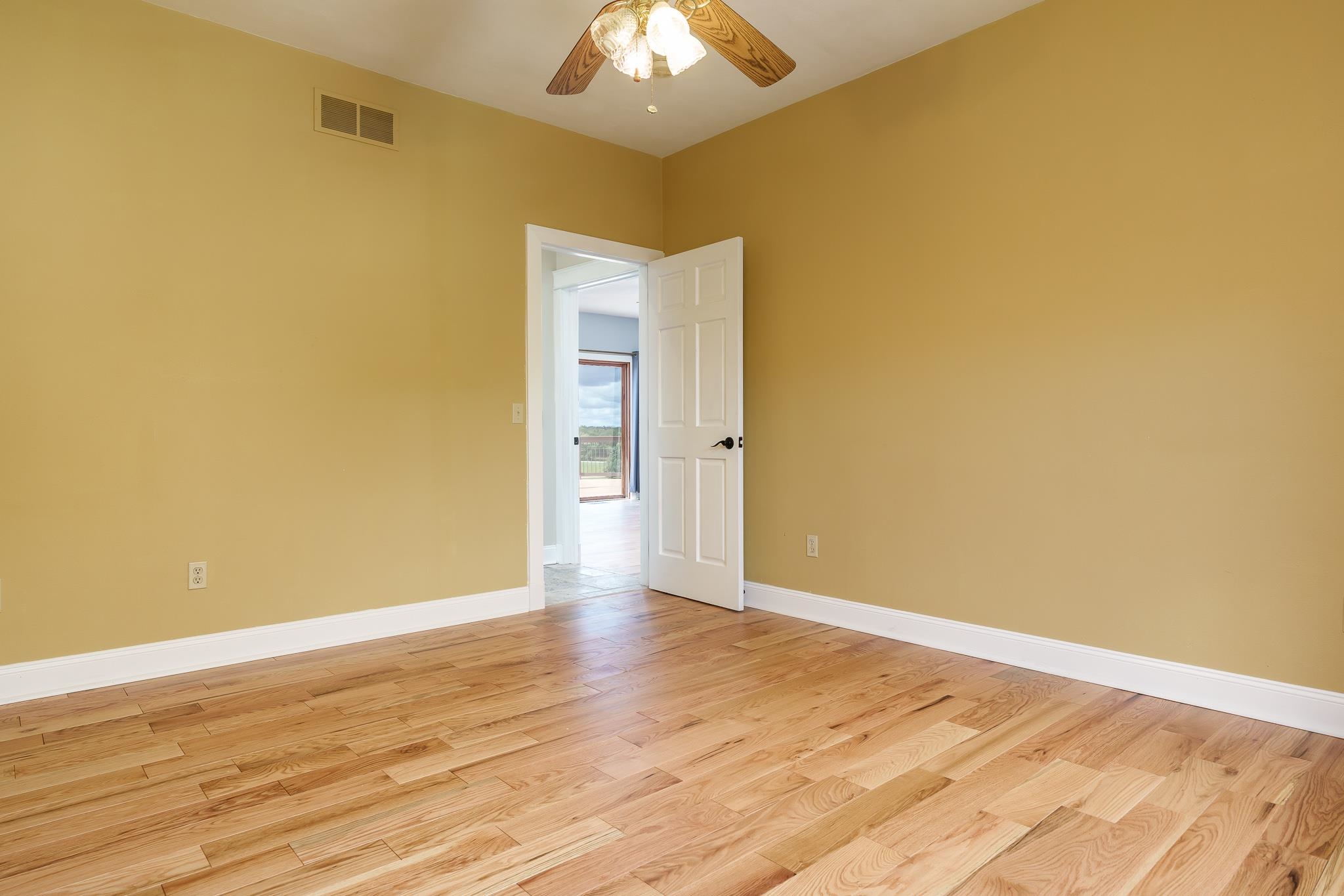 14949 Saunders Road Pecatonica, IL 61063 - Photo 25 of 88 a view of an empty room with wooden floor and a window