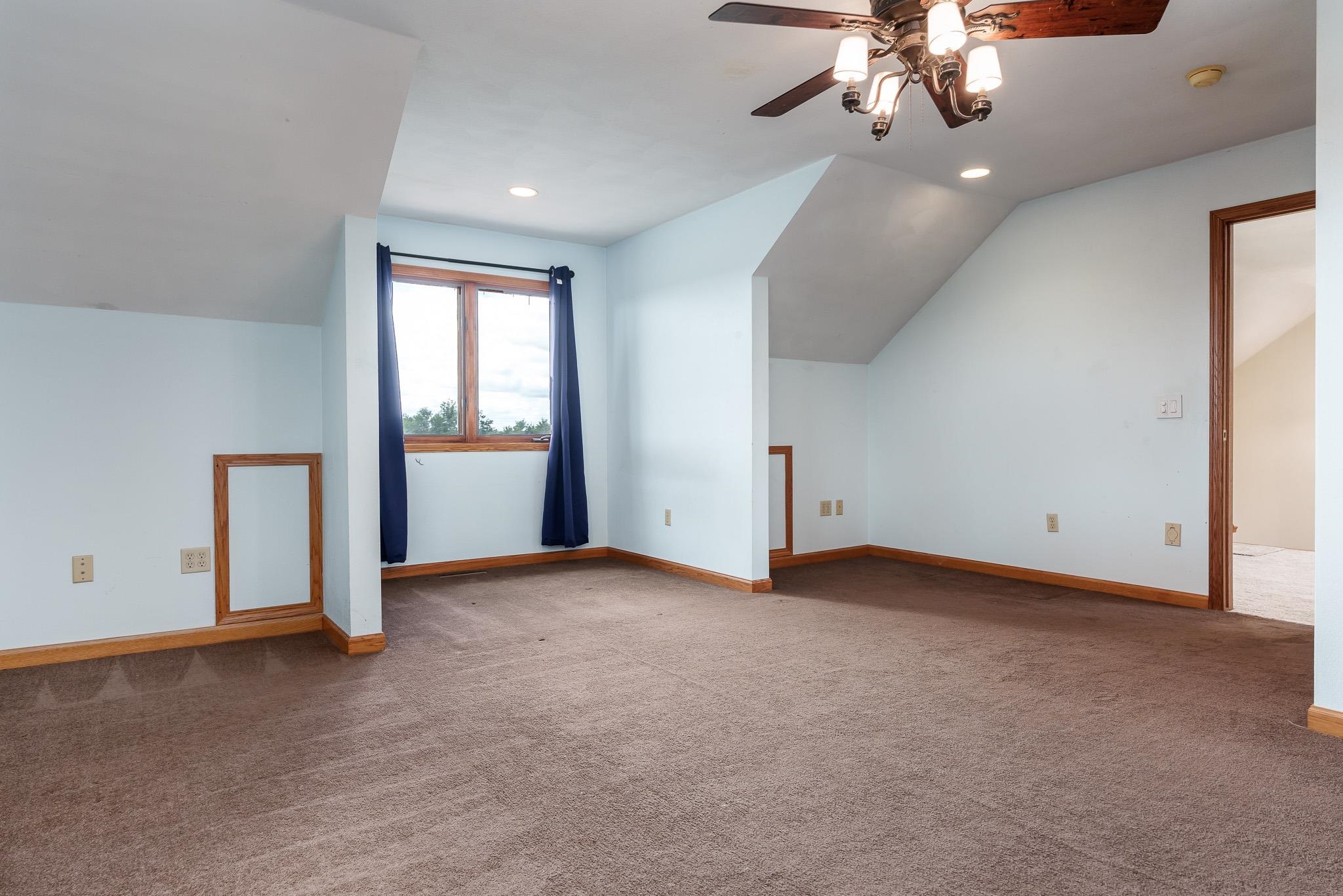 14949 Saunders Road Pecatonica, IL 61063 - Photo 43 of 88 an empty room with chandelier fan and windows