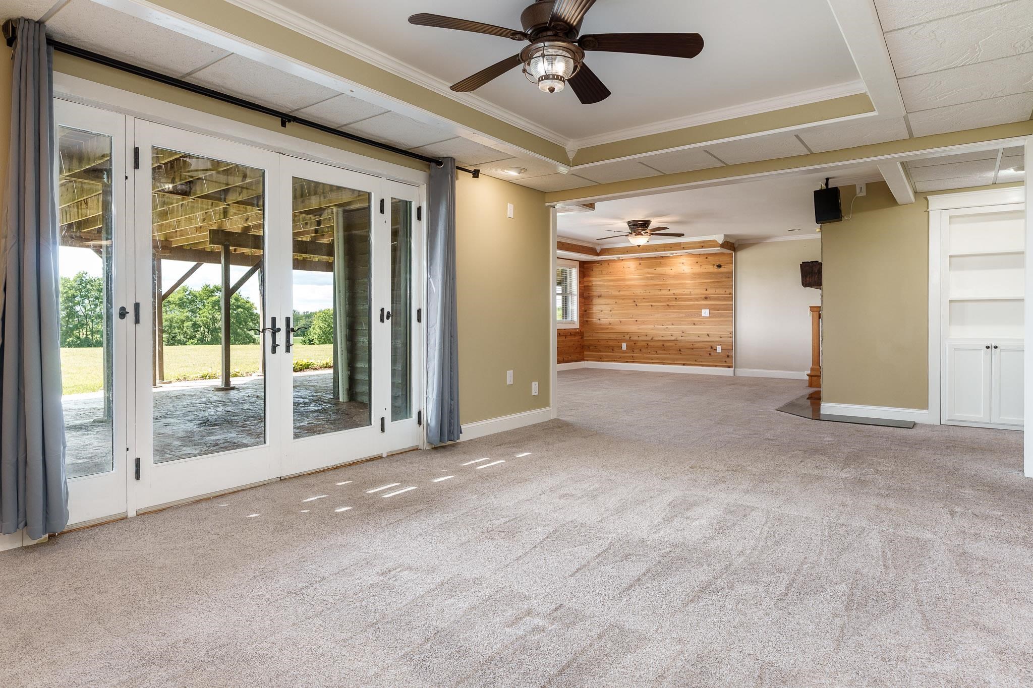 14949 Saunders Road Pecatonica, IL 61063 - Photo 50 of 88 a view of a livingroom with a ceiling fan and window